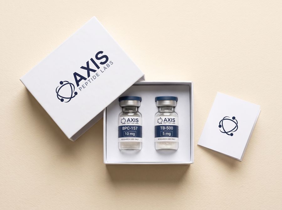 An open white Axis Peptide Labs box with two vials seated in the foam insert